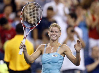 Camila Giorgi of Italy celebrates defeating Caroline Wozniacki of Denmark at the U.S. Open tennis championships in New York August 31, 2013. Camila Giorgi of Italy celebrates defeating Caroline Wozniacki of Denmark at the U.S. Open tennis championships in New York August 31, 2013.