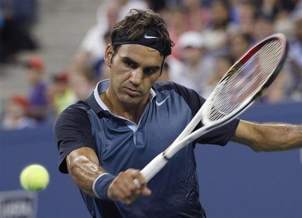 Roger Federer of Switzerland returns a backhand to Adrian Mannarino of France at the U.S. Open tennis championships in New York, August 31, Roger Federer of Switzerland returns a backhand to Adrian Mannarino of France at the U.S. Open tennis championships in New York, August 31,