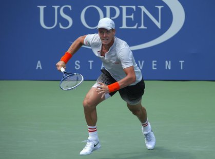 Tomas Berdych of the Czech Republic runs to the net for a return from Julien Benneteau of France at the U.S. Open tennis championships in Ne Tomas Berdych of the Czech Republic runs to the net for a return from Julien Benneteau of France at the U.S. Open tennis championships in Ne