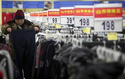 A customer selects trousers at a supermarket in Wuhan, Hubei province February 9, 2012. REUTERS/Stringer A customer selects trousers at a supermarket in Wuhan, Hubei province February 9, 2012. REUTERS/Stringer