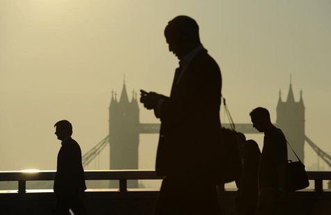 Workers cross London Bridge, with Tower Bridge seen behind, during the morning rush hour in London September 30, 2011. REUTERS/Paul Hackett Workers cross London Bridge, with Tower Bridge seen behind, during the morning rush hour in London September 30, 2011. REUTERS/Paul Hackett