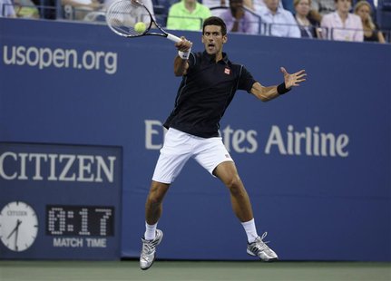 Novak Djokovic of Serbia returns a forehand to Joao Sousa of Portugal at the U.S. Open tennis championships in New York, September 1, 2013. Novak Djokovic of Serbia returns a forehand to Joao Sousa of Portugal at the U.S. Open tennis championships in New York, September 1, 2013.