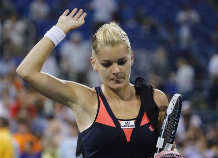 Agnieszka Radwanska of Poland walks off the court after losing her match to Ekaterina Makarova of Russia at the U.S. Open tennis championshi Agnieszka Radwanska of Poland walks off the court after losing her match to Ekaterina Makarova of Russia at the U.S. Open tennis championshi