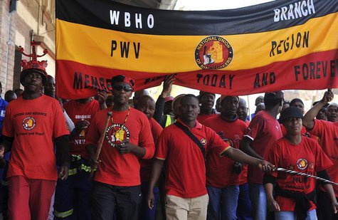 Members of the National Union of Mineworkers (NUM) take part in a strike in the central business district area of Johannesburg, August 27, 2 Members of the National Union of Mineworkers (NUM) take part in a strike in the central business district area of Johannesburg, August 27, 2