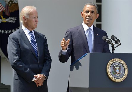 U.S. President Barack Obama speaks next to Vice President Joe Biden (L) at the Rose Garden of the White House August 31, 2013, in Washington U.S. President Barack Obama speaks next to Vice President Joe Biden (L) at the Rose Garden of the White House August 31, 2013, in Washington