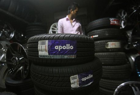 An employee works inside a showroom selling Apollo tyres in Mumbai June 13, 2013. REUTERS/Danish Siddiqui An employee works inside a showroom selling Apollo tyres in Mumbai June 13, 2013. REUTERS/Danish Siddiqui
