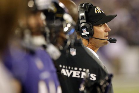 Baltimore Ravens head coach John Harbaugh (R) watches from the sideline during the first half of their NFL pre-season football game against Baltimore Ravens head coach John Harbaugh (R) watches from the sideline during the first half of their NFL pre-season football game against