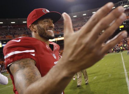 San Francisco 49ers quarterback Colin Kaepernick extends his hands after the Denver Broncos defeated the 49ers in their NFL pre-season footb San Francisco 49ers quarterback Colin Kaepernick extends his hands after the Denver Broncos defeated the 49ers in their NFL pre-season footb