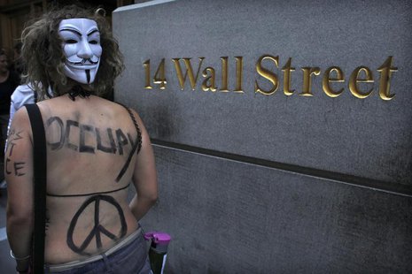 An Occupy Wall Street activist takes part in a march in downtown Manhattan in New York July 11, 2012. REUTERS/Eduardo Munoz An Occupy Wall Street activist takes part in a march in downtown Manhattan in New York July 11, 2012. REUTERS/Eduardo Munoz