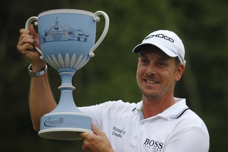 Henrik Stenson of Sweden poses with the trophy after winning the 2013 Deutsche Bank Championship golf tournament in Norton, Massachusetts Se Henrik Stenson of Sweden poses with the trophy after winning the 2013 Deutsche Bank Championship golf tournament in Norton, Massachusetts Se