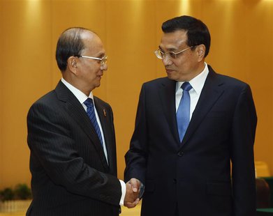 Chinese Premier Li Keqiang (R) shakes hands with Myanmar's President Thein Sein ahead of the 10th China-ASEAN Expo in Nanning, Guangxi Zhuan Chinese Premier Li Keqiang (R) shakes hands with Myanmar's President Thein Sein ahead of the 10th China-ASEAN Expo in Nanning, Guangxi Zhuan