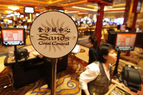 A logo of Sands Cotai Central is seen on a gaming table inside a casino on the opening day of the Sands Cotai Central, Sands' newest integra A logo of Sands Cotai Central is seen on a gaming table inside a casino on the opening day of the Sands Cotai Central, Sands' newest integra