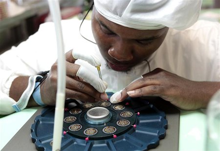 Technician Willie Holley, 26, reworks the caliber movements of Shinola watches being assembled at its manufacturing location in the New Cent Technician Willie Holley, 26, reworks the caliber movements of Shinola watches being assembled at its manufacturing location in the New Cent