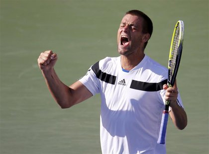 Mikhail Youzhny of Russia celebrates his victory over Lleyton Hewitt of Australia at the U.S. Open tennis championships in New York Septembe Mikhail Youzhny of Russia celebrates his victory over Lleyton Hewitt of Australia at the U.S. Open tennis championships in New York Septembe