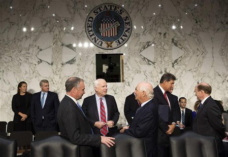 Senators John McCain (R-AZ) (center), Tim Kaine (D-VA) and Ben Cardin (D-MD) (right) speak before Chairman of the Joint Chiefs General Marti Senators John McCain (R-AZ) (center), Tim Kaine (D-VA) and Ben Cardin (D-MD) (right) speak before Chairman of the Joint Chiefs General Marti