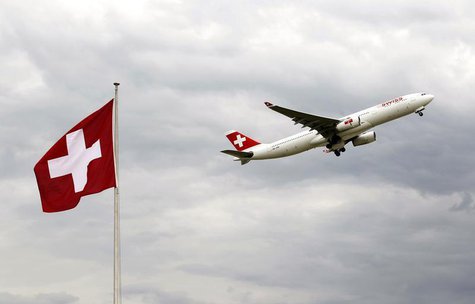 An Airbus A 330-343E of Swiss airlines takes-off past a Swiss national flag from the airport in Zurich October 4, 2012. REUTERS/Arnd Wiegman An Airbus A 330-343E of Swiss airlines takes-off past a Swiss national flag from the airport in Zurich October 4, 2012. REUTERS/Arnd Wiegman