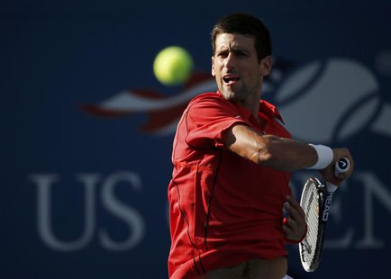 Novak Djokovic of Serbia hits a return to Marcel Granollers of Spain at the U.S. Open tennis championships in New York September 3, 2013. RE Novak Djokovic of Serbia hits a return to Marcel Granollers of Spain at the U.S. Open tennis championships in New York September 3, 2013. RE