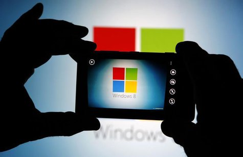 A man uses the camera of a Nokia Lumia 820 smartphone as he poses in this photo illustration taken in the central Bosnian town of Zenica, Se A man uses the camera of a Nokia Lumia 820 smartphone as he poses in this photo illustration taken in the central Bosnian town of Zenica, Se