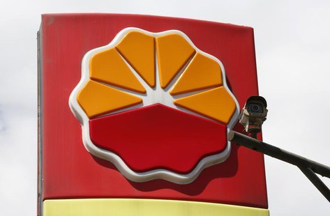 A security camera is seen in front of the logo of Petrochina at its gas station in Beijing August 29, 2013. REUTERS/Kim Kyung-Hoon A security camera is seen in front of the logo of Petrochina at its gas station in Beijing August 29, 2013. REUTERS/Kim Kyung-Hoon