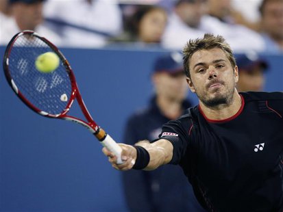 Stanislas Wawrinka of Switzerland reaches for a forehand to Tomas Berdych of the Czech Republic at the U.S. Open tennis championships in New Stanislas Wawrinka of Switzerland reaches for a forehand to Tomas Berdych of the Czech Republic at the U.S. Open tennis championships in New