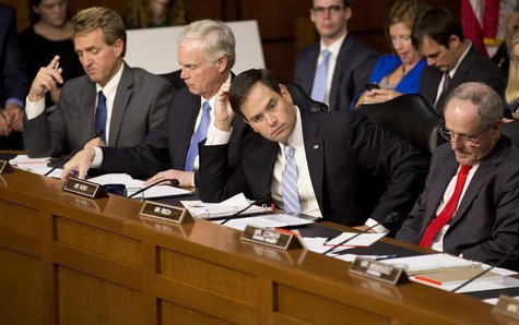 (L-R) Senators Jeff Flake (R-AZ), Ron Johnson (R-WI), Marco Rubio (R-FL) and James Risch (R-ID) listen as (not pictured) U.S. Defense Secret (L-R) Senators Jeff Flake (R-AZ), Ron Johnson (R-WI), Marco Rubio (R-FL) and James Risch (R-ID) listen as (not pictured) U.S. Defense Secret