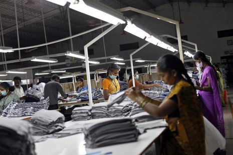 Employees sort clothes before packing them at the Estee garment factory in Tirupur, in the southern Indian state of Tamil Nadu June 19, 2013 Employees sort clothes before packing them at the Estee garment factory in Tirupur, in the southern Indian state of Tamil Nadu June 19, 2013