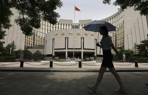 A woman walks past the headquarters of the People's Bank of China (PBOC), the central bank, in Beijing, June 21, 2013. REUTERS/Jason Lee A woman walks past the headquarters of the People's Bank of China (PBOC), the central bank, in Beijing, June 21, 2013. REUTERS/Jason Lee