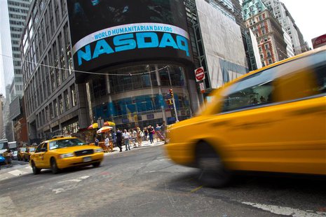 Taxi cabs drive past the Nasdaq MarketSite in New York's Times Square, August 23, 2013. REUTERS/Andrew Kelly Taxi cabs drive past the Nasdaq MarketSite in New York's Times Square, August 23, 2013. REUTERS/Andrew Kelly