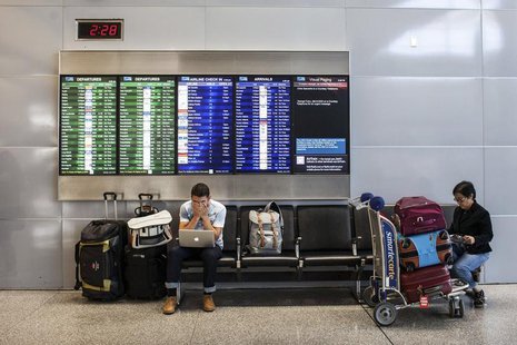 Passengers wait for their delayed flights after an Asiana Airlines Boeing 777 crashed and burst into flames as it landed at San Francisco In Passengers wait for their delayed flights after an Asiana Airlines Boeing 777 crashed and burst into flames as it landed at San Francisco In