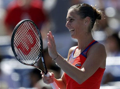 Flavia Pennetta of Italy reacts after defeating compatriot Roberta Vinci at the U.S. Open tennis championships in New York September 4, 2013 Flavia Pennetta of Italy reacts after defeating compatriot Roberta Vinci at the U.S. Open tennis championships in New York September 4, 2013