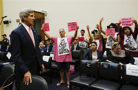 U.S. Secretary of State John Kerry faces protesters against a military strike in Syria, as he arrives at a U.S. House Foreign Affairs Commit U.S. Secretary of State John Kerry faces protesters against a military strike in Syria, as he arrives at a U.S. House Foreign Affairs Commit
