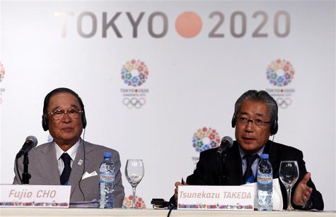 Japan Olympic Committee President Tsunekazu Takeda (R) speaks next to Toyota chairman Fujio Cho during a news conference in support of the T Japan Olympic Committee President Tsunekazu Takeda (R) speaks next to Toyota chairman Fujio Cho during a news conference in support of the T