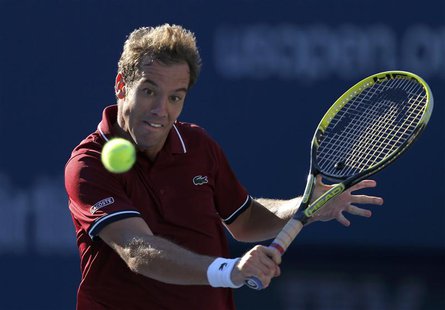 Richard Gasquet of France hits a return to David Ferrer of Spain at the U.S. Open tennis championships in New York September 4, 2013. REUTER Richard Gasquet of France hits a return to David Ferrer of Spain at the U.S. Open tennis championships in New York September 4, 2013. REUTER