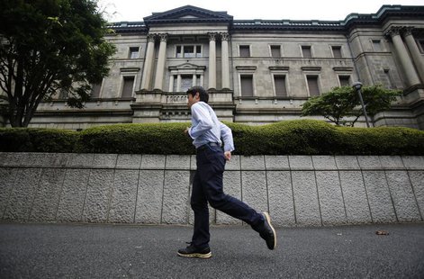 A pedestrian walks past the Bank of Japan headquarters in Tokyo August 8, 2013. REUTERS/Yuya Shino A pedestrian walks past the Bank of Japan headquarters in Tokyo August 8, 2013. REUTERS/Yuya Shino