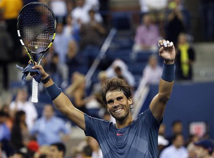 Rafael Nadal of Spain celebrates defeating compatriot Tommy Robredo during their men's quarter-final match at the U.S. Open tennis champions Rafael Nadal of Spain celebrates defeating compatriot Tommy Robredo during their men's quarter-final match at the U.S. Open tennis champions