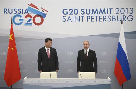 Russia's President Vladimir Putin (R) meets with his Chinese counterpart Xi Jinping at the G20 Summit in Strelna near St. Petersburg, Septem Russia's President Vladimir Putin (R) meets with his Chinese counterpart Xi Jinping at the G20 Summit in Strelna near St. Petersburg, Septem