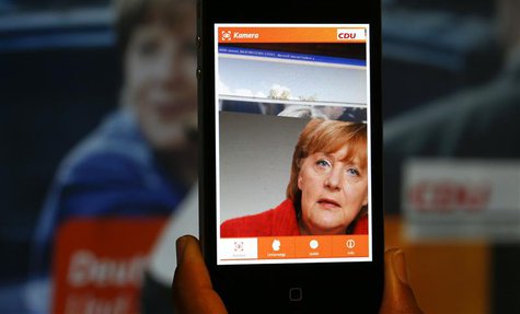 A 'Merkel app' with a portrait of German Chancellor Angela Merkel is pictured on a smartphone in Berlin, September 5, 2013. REUTERS/Pawel Ko A 'Merkel app' with a portrait of German Chancellor Angela Merkel is pictured on a smartphone in Berlin, September 5, 2013. REUTERS/Pawel Ko