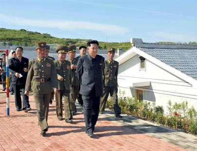 North Korean leader Kim Jong-un (front) is pictured during his inspection of the defence detachment on Jangjae Islet and the Hero Defence De North Korean leader Kim Jong-un (front) is pictured during his inspection of the defence detachment on Jangjae Islet and the Hero Defence De