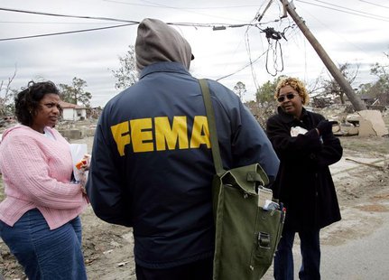 Lower Ninth Ward residents Eileen Lange (L) and Janet Aubert (R) question a representative from the Federal Emergency Management Agency (FEM Lower Ninth Ward residents Eileen Lange (L) and Janet Aubert (R) question a representative from the Federal Emergency Management Agency (FEM