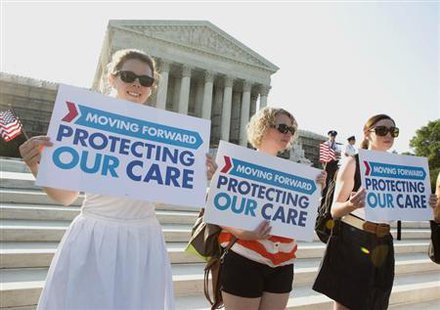 Supporters of the Affordable Healthcare Act gather in front of the Supreme Court before the court's announcement of the legality of the law in Washington on June 28, 2012.
Credit: Reuters/Joshua Roberts Supporters of the Affordable Healthcare Act gather in front of the Supreme Court before the court's announcement of the legality of the law in Washington on June 28, 2012.
Credit: Reuters/Joshua Roberts
