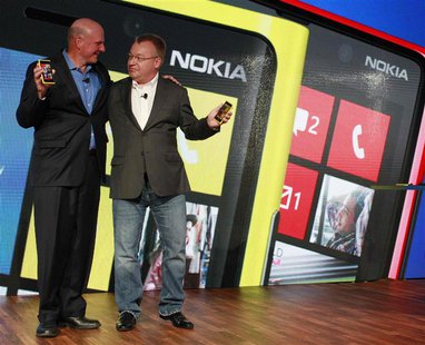 Microsoft Chief Executive Steve Ballmer (L) and his Nokia counterpart Stephen Elop introduce new Nokia phones with Microsoft's Windows 8 ope Microsoft Chief Executive Steve Ballmer (L) and his Nokia counterpart Stephen Elop introduce new Nokia phones with Microsoft's Windows 8 ope