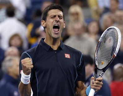 Novak Djokovic of Serbia celebrates defeating Mikhail Youzhny of Russia during their quarter-final match at the U.S. Open tennis championshi Novak Djokovic of Serbia celebrates defeating Mikhail Youzhny of Russia during their quarter-final match at the U.S. Open tennis championshi