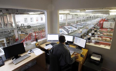An operator watches display screens in a control room at a clothing factory of Spanish textile retailer Mango in the industrial town of Pala An operator watches display screens in a control room at a clothing factory of Spanish textile retailer Mango in the industrial town of Pala
