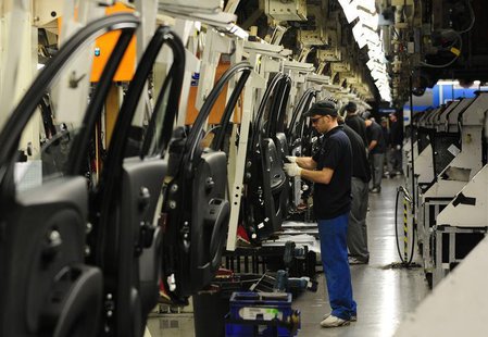 Employees work on cars on the Nissan production line at the company's factory in Washington, northern England in this March 20, 2009 file ph Employees work on cars on the Nissan production line at the company's factory in Washington, northern England in this March 20, 2009 file ph