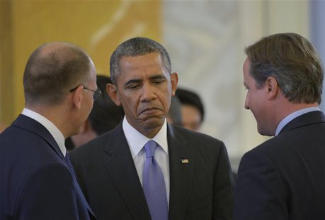 Italy's Prime Minister Enrico Letta (L), U.S. President Barack Obama (C) and British Prime Minister David Cameron (R) talk at the second wor Italy's Prime Minister Enrico Letta (L), U.S. President Barack Obama (C) and British Prime Minister David Cameron (R) talk at the second wor