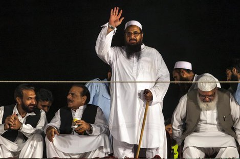 Hafiz Saeed, head of the Jamaat-ud-Dawa organisation and founder of Lashkar-e-Taiba, waves to his supporters during a rally marking Pakistan Hafiz Saeed, head of the Jamaat-ud-Dawa organisation and founder of Lashkar-e-Taiba, waves to his supporters during a rally marking Pakistan