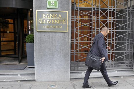 A man walks past Slovenia's Central Bank in Ljubljana July 15, 2011. REUTERS/Srdjan Zivulovic A man walks past Slovenia's Central Bank in Ljubljana July 15, 2011. REUTERS/Srdjan Zivulovic