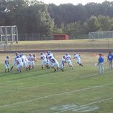 Saugatuck football coach Bill Dunn (third from right) watches his team prepare for a 59-6 win at Marcellus on Sept. 6, 2013. Saugatuck football coach Bill Dunn (third from right) watches his team prepare for a 59-6 win at Marcellus on Sept. 6, 2013.