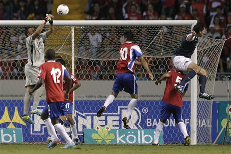 Costa Rica's goalkeeper Keilor Navas (L) jumps for the ball near teammates Joel Campbell (12), Bryan Ruiz (10), Celso Borges (5) and Geoff C Costa Rica's goalkeeper Keilor Navas (L) jumps for the ball near teammates Joel Campbell (12), Bryan Ruiz (10), Celso Borges (5) and Geoff C
