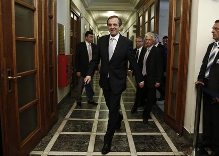 Greece's Prime Minister Antonis Samaras (C) arrives for a cabinet meeting in Athens June 25, 2013. REUTERS/Yorgos Karahalis Greece's Prime Minister Antonis Samaras (C) arrives for a cabinet meeting in Athens June 25, 2013. REUTERS/Yorgos Karahalis